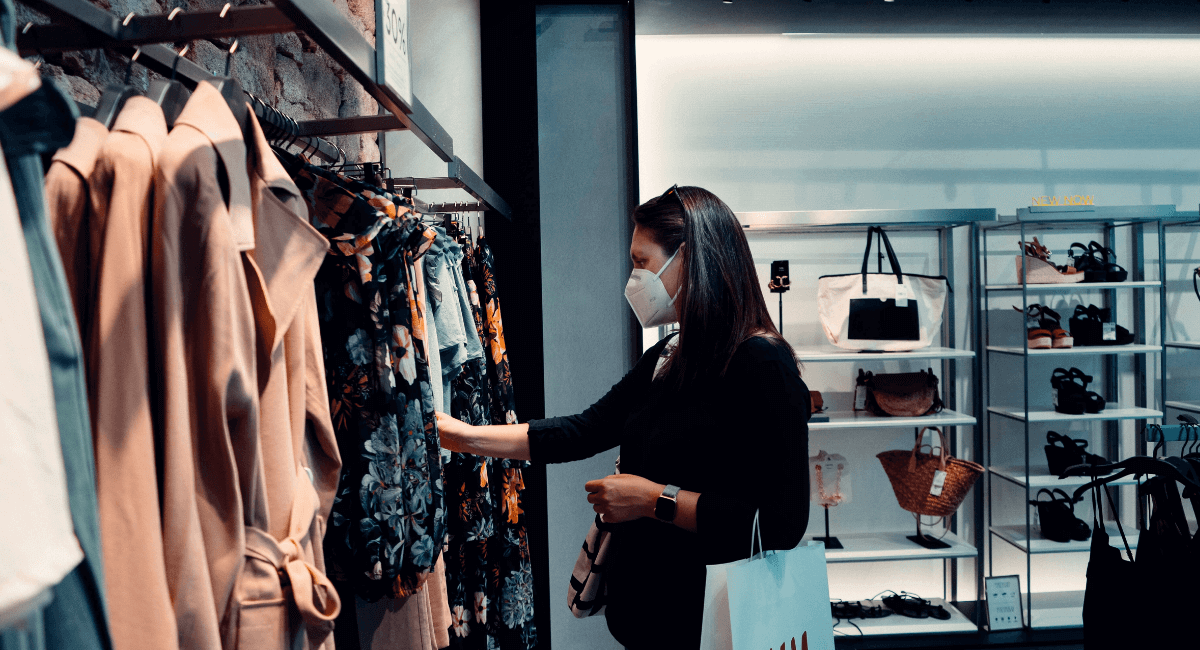 Shopping Addiction Statistics - Woman browsing in a store